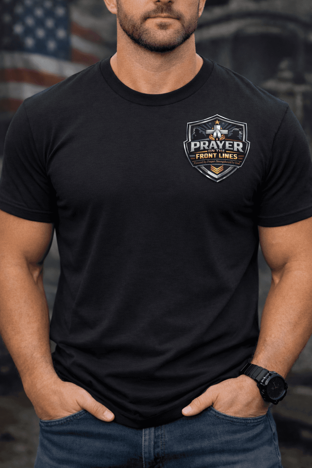 Man wearing a black t-shirt with a 'Prayer on the Front Lines' shield logo.